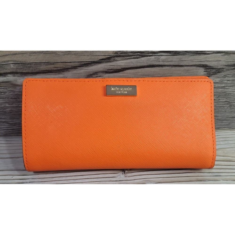 Kate Spade Wallet bright orange. Used great shape Card holder stripes inside